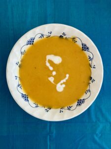 Bowl of butternut squash soup with a swirl of cream
