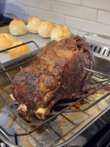 Finished standing rib roast in pan on the stove