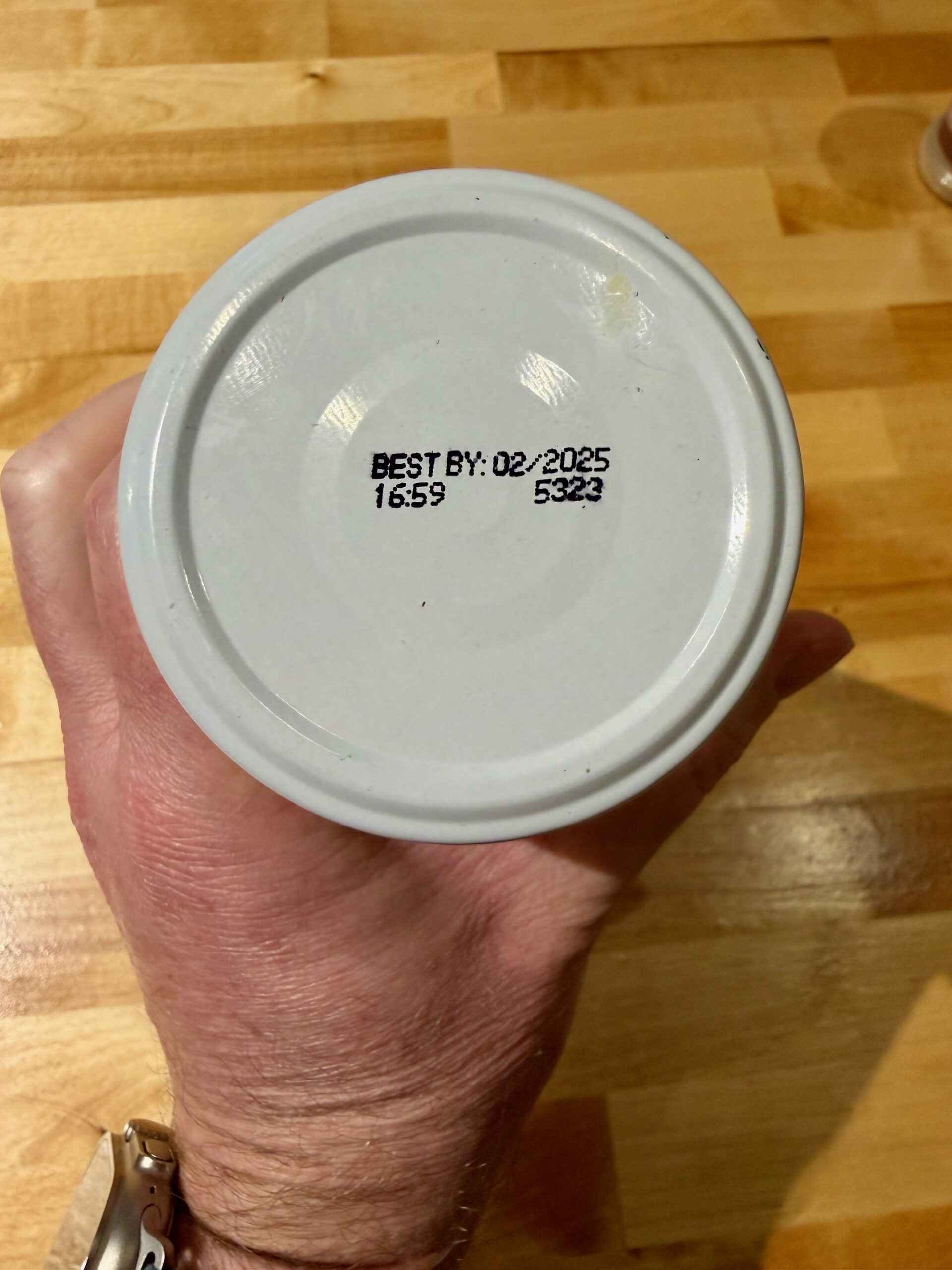 Past expiration date on the lid of a jar of tahini