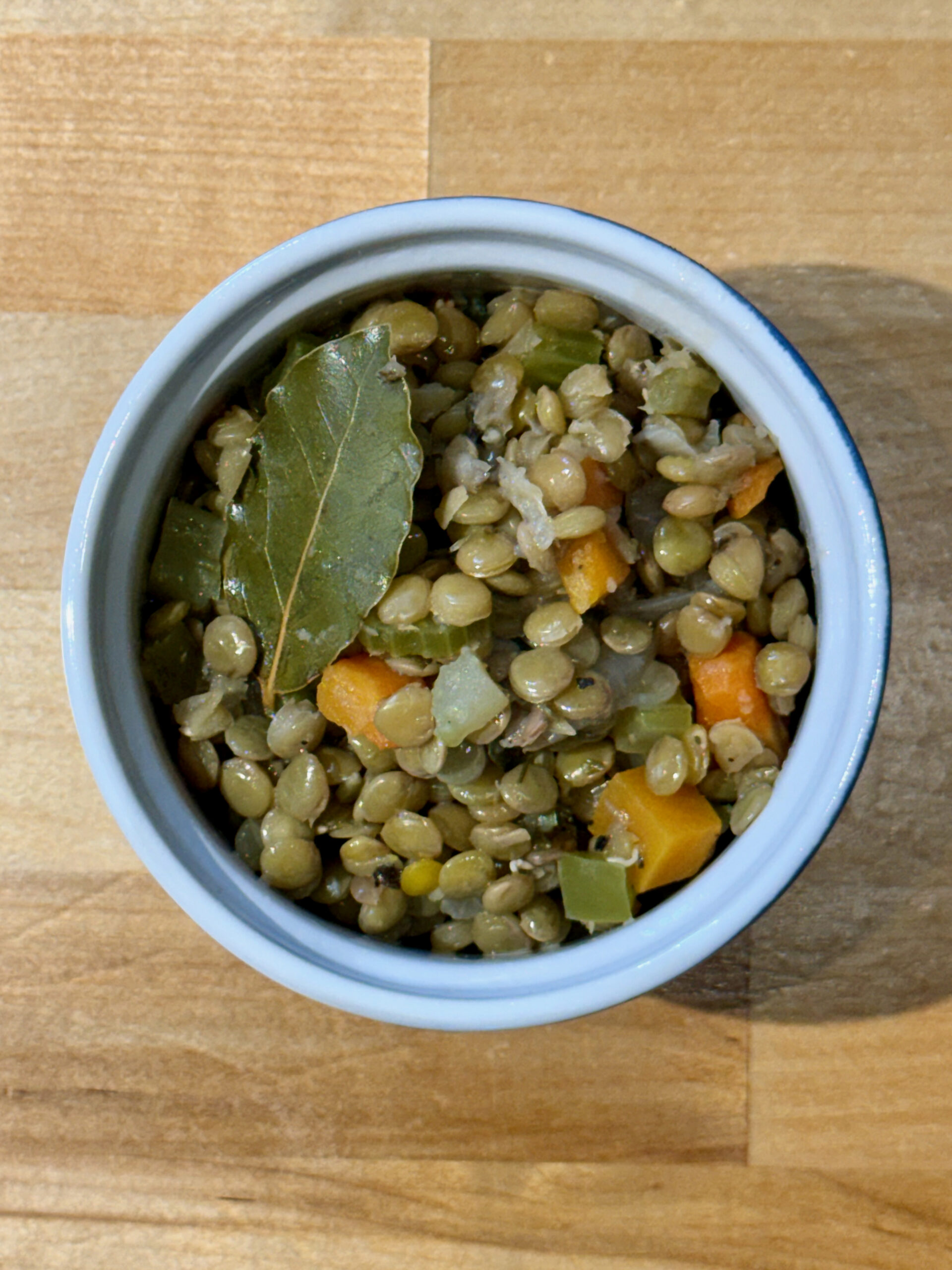 Prepared Italian lentils in a blue and white ramekin