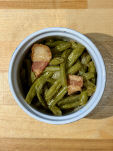 Cooked southern style green beans in a ramekin