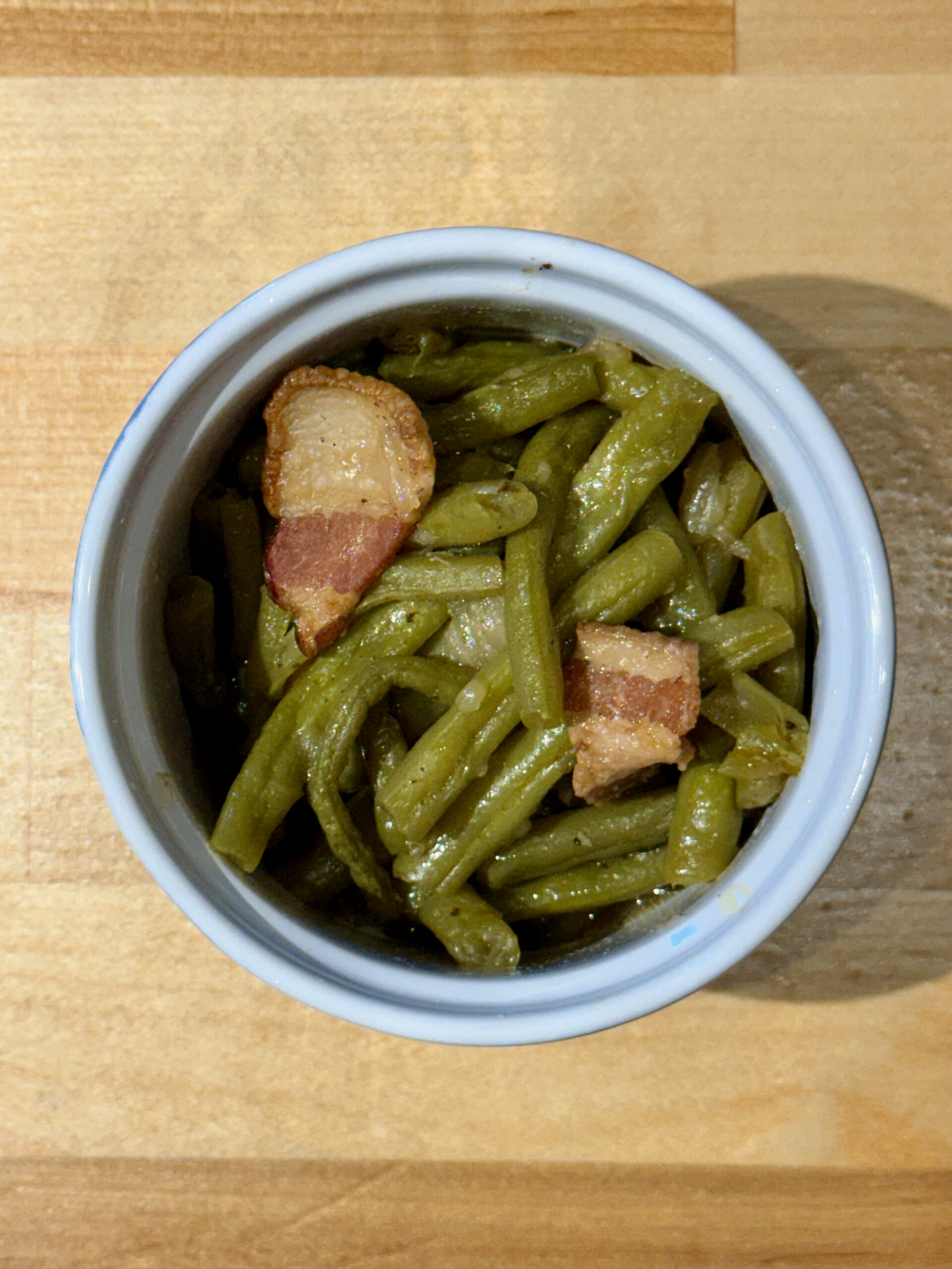 Cooked southern style green beans in a ramekin