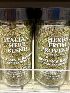 Dried Italian Herb and Herbs form Provence jars on a store shelf